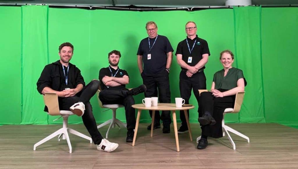 production bureau staff working with the cll exchange with green screen and on hand support with filming and directing